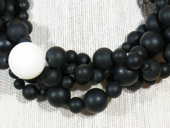 
BLACK MATT AGATE WITH WHITE CORAL BALL WITH STERLING SILVER CLASP