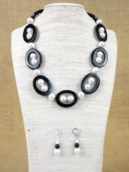 
BLACK AGATE DONUTS & WHITE SHELL PEARLS WITH STERLING SILVER CLASP