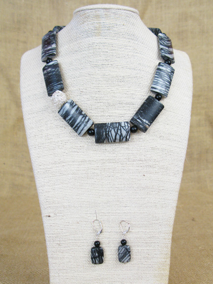 
BLACK AND WHITE BLACK JASPER NETWORK & BLACKSTONE WITH STERLING SILVER WIRE BALL AND CLASP