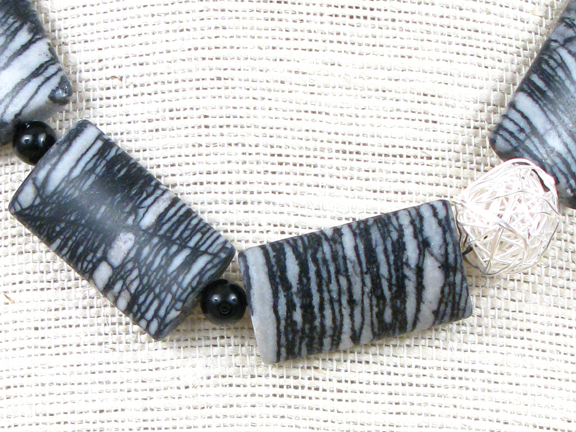 
BLACK AND WHITE BLACK JASPER NETWORK & BLACKSTONE WITH STERLING SILVER WIRE BALL AND CLASP