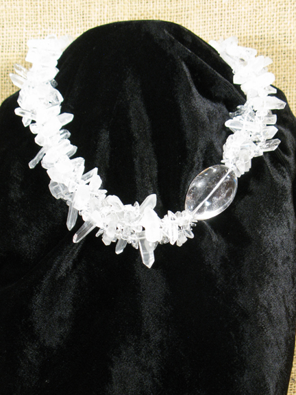 
CLEAR QUARTZ PIECES AND LARGE CLEAR QUARTZ NUGGET WITH STERLING CLASP ON BLACK VELVET
