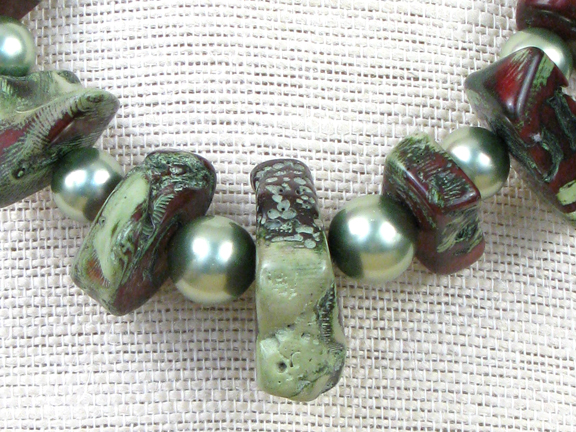 GREEN AND BURGUNDY CORAL & GREEN SHELL PEARLS WITH GOLD VERMEIL CLASP
