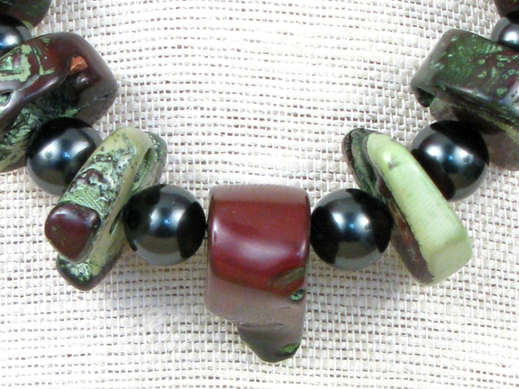 
GREEN & BURGUNDY CORAL & DARK GREEN SHELL PEARLS WITH GOLD VERMEIL CLASP