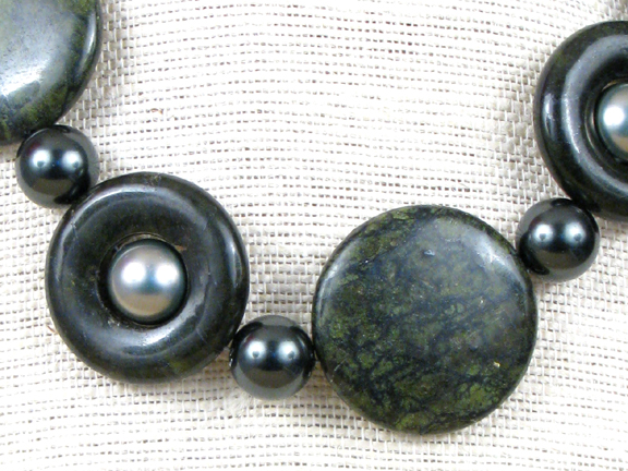 
GREEN RUSSIAN SERPENTINE DONUTS AND SOLIDS & DARK AND LIGHT GREEN SHELL PEARLS WITH STERLING CLASP