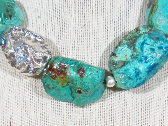
TURQUOISE COLORED CHYRSOCOLLA WITH LARGE STERLING SILVER NUGGET