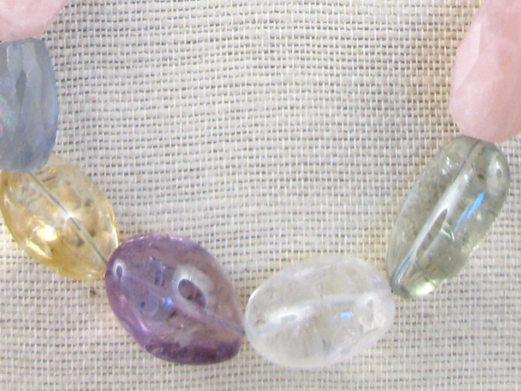 
PINK, PURPLE, GREEN, CLEAR, BLUE COLORED QUARTZ, YELLOW CITRINE AND FLUORITE WITH STERLING SILVER CLASP