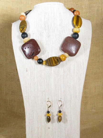 
BROWN LAVA, TIGER, SERPENTINE, AVENTURINE, BLACK ONYX, GOLD JADE & CARNELIAN WITH A GOLD PLATED CLASP