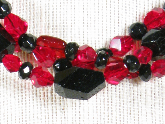 
RED GLASS AND BLACK TOURMALINE WITH GOLD PLATED CLASP