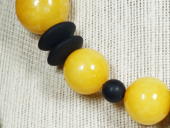 
YELLOW JADE and BLACK AGATE DISKS WITH GOLD PLATED CLASP