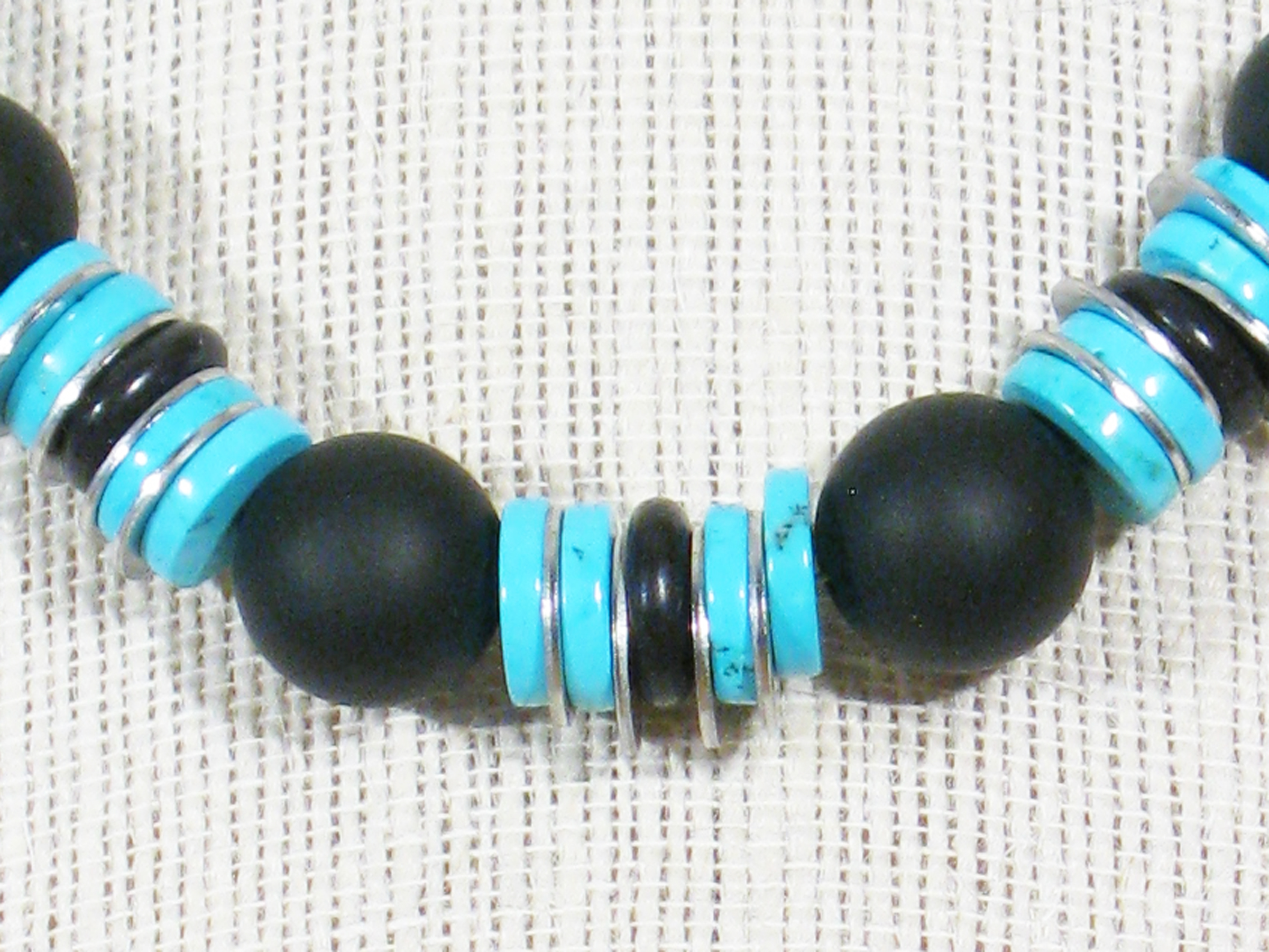 
BLACK AGATE, TURQUOISE HOWLITE, & STAINLESS STEEL NUTS WITH STERLING CLASP