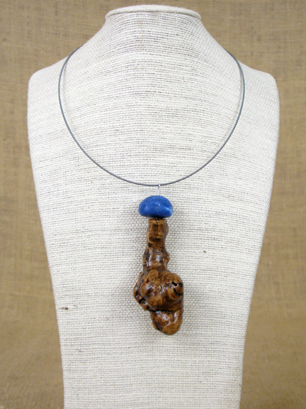 
BURLED ROOT WITH BLUE SERPENTINE WITH STERLING COLLAR