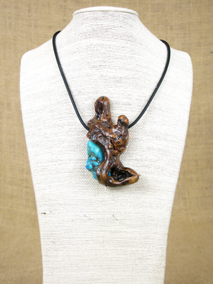 
BURLED ROOT & TURQUOISE CARVED INTO ROOT WITH RUBBER COLLAR