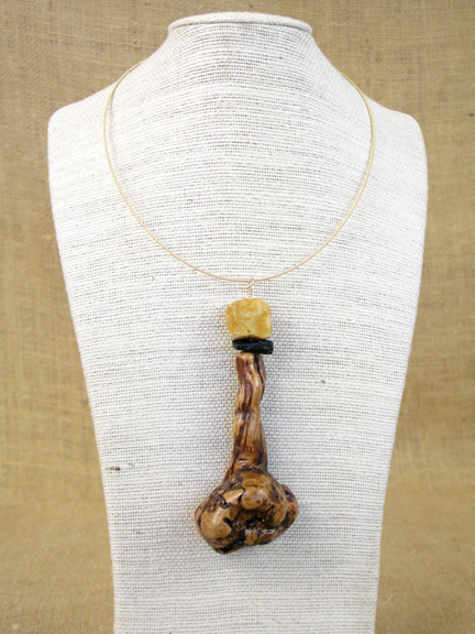
BURLED ROOT WITH YELLOW JASPER & METEORITE WITH GOLD COLLAR