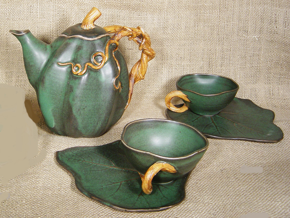 FIREWORKS VINE POTTERY TEA SET - SET OF 4 CUPS AND SAUCERS AND ONE TEAPOT